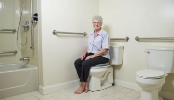 A senior using a modified bathroom